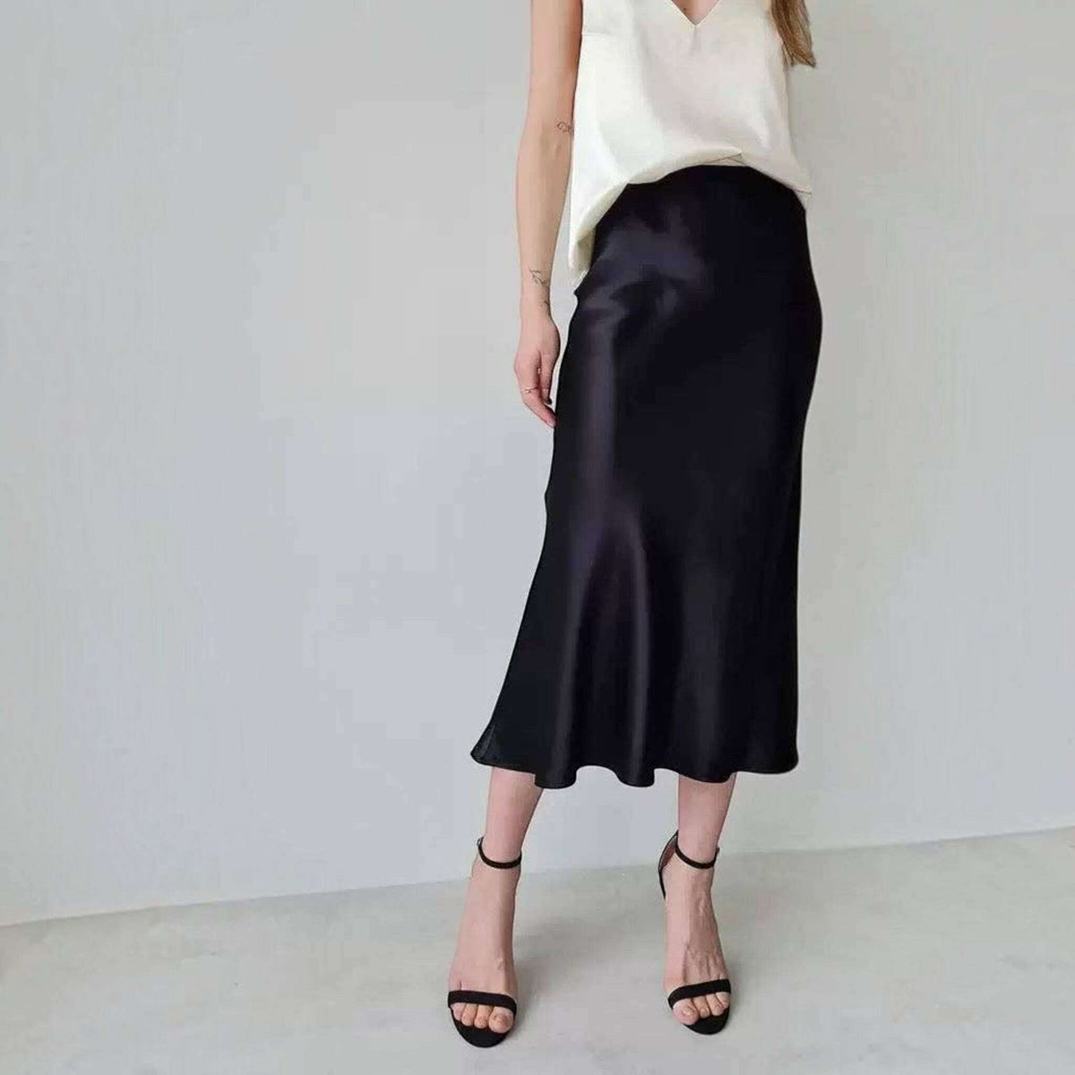 Plum Bottom ELLYNDALE black sateen maxi skirt with elastic waistband and invisible zipper on a model