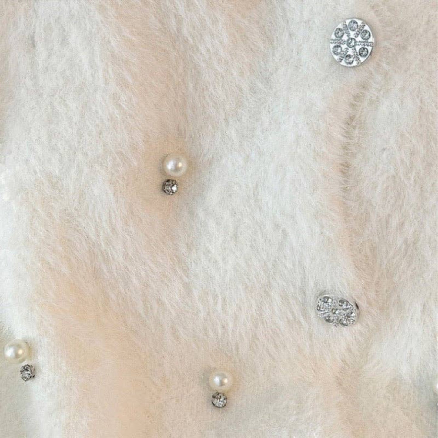 Plum Bottom fluffy bolero featuring scattered white pearls and sparkling diamond-like embellishments on soft fabric.