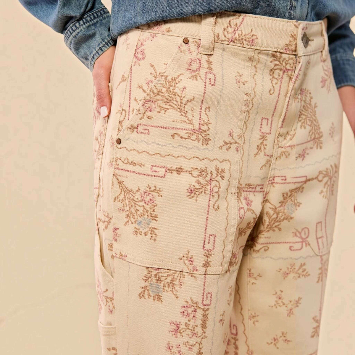 Plum Bottom TRIBAL Audrey carpenter pants in cream with a vintage-inspired pink and brown floral print pattern
