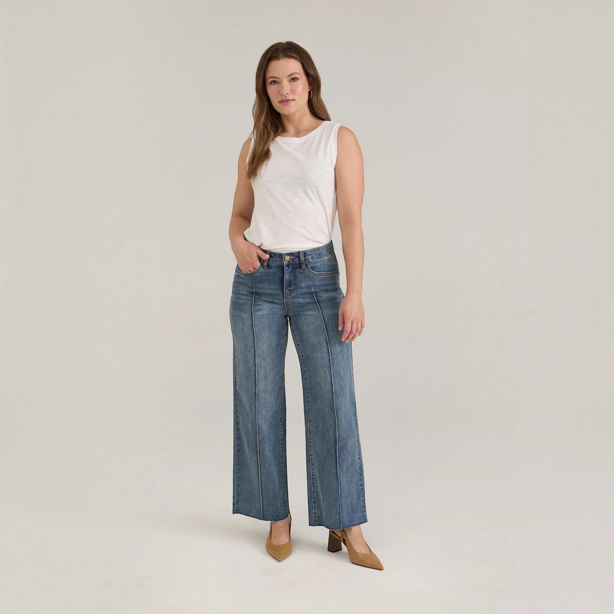 Plum Bottom FDJ Olivia wide ankle jeans in medium wash denim with front seam detailing worn by a model