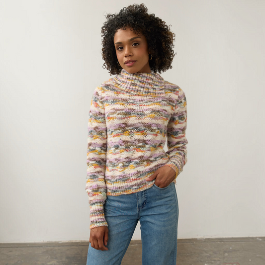 Plum Bottom FDJ envelope collar sweater in a multi-colored space dye knit worn by a model with blue jeans.