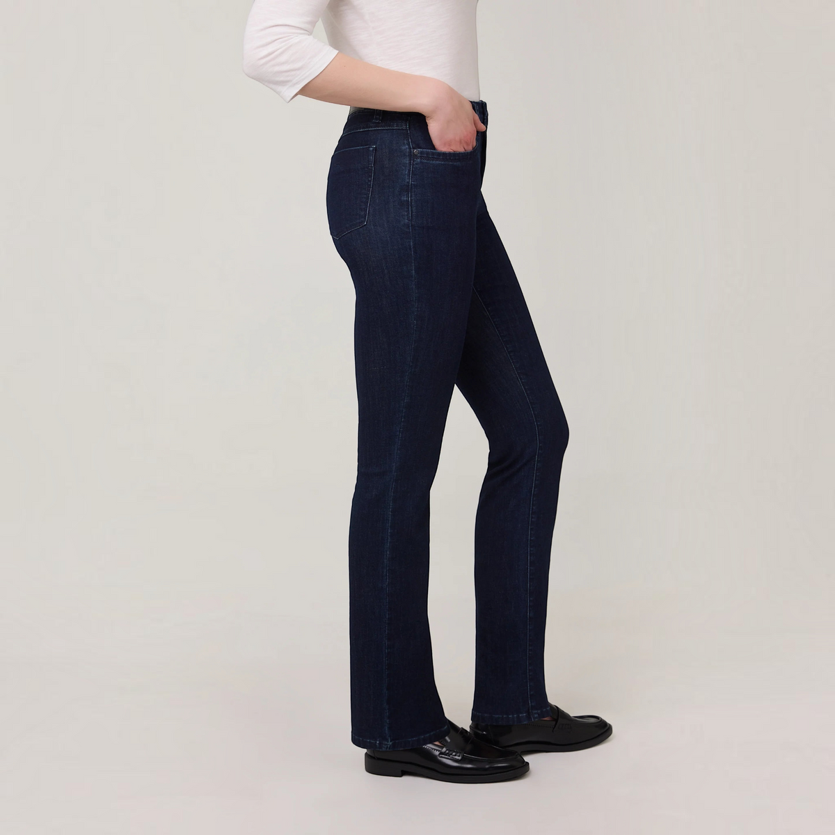 Plum Bottom FDJ Olivia straight leg jeans in dark wash denim worn by a model in profile view