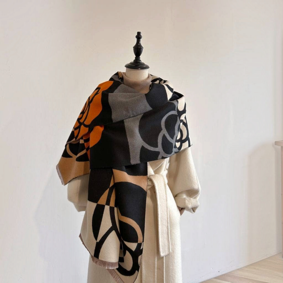 [Winding River - Orange / Black Geo Rose Reversible Wrap], [Scarf], [Winding River], [Plum Bottom].