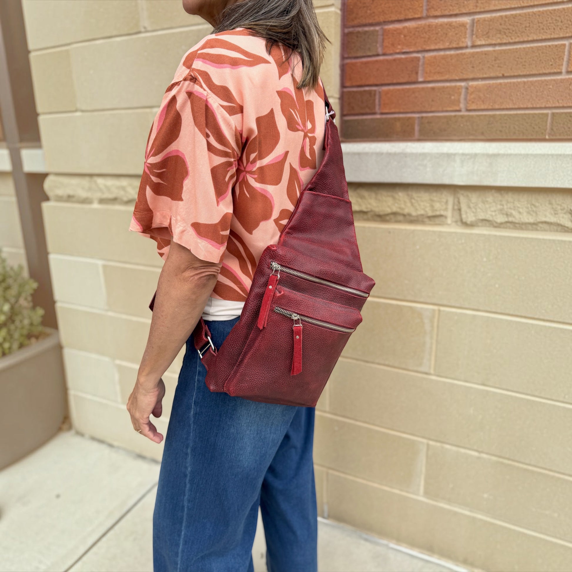 Plum Bottom DANIELLA LEHAVHI red leather sling bag worn crossbody