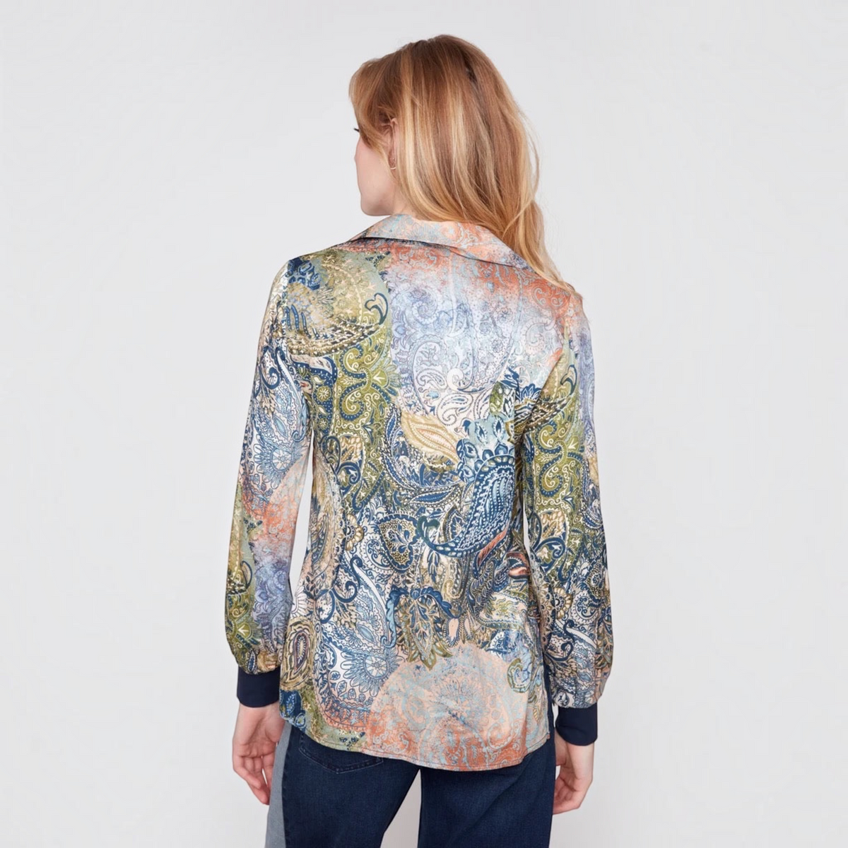Back view of a RENUAR olive paisley print blouse with long sleeves and navy cuffs, styled by Plum Bottom