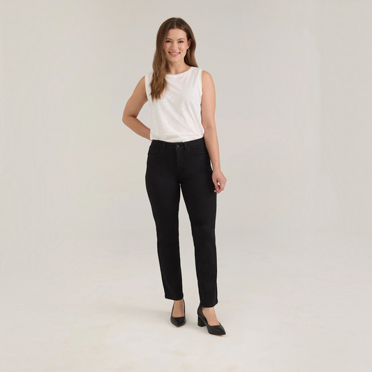 Plum Bottom FDJ Olivia petite straight leg jeans in onyx black denim worn by a woman with a white sleeveless top