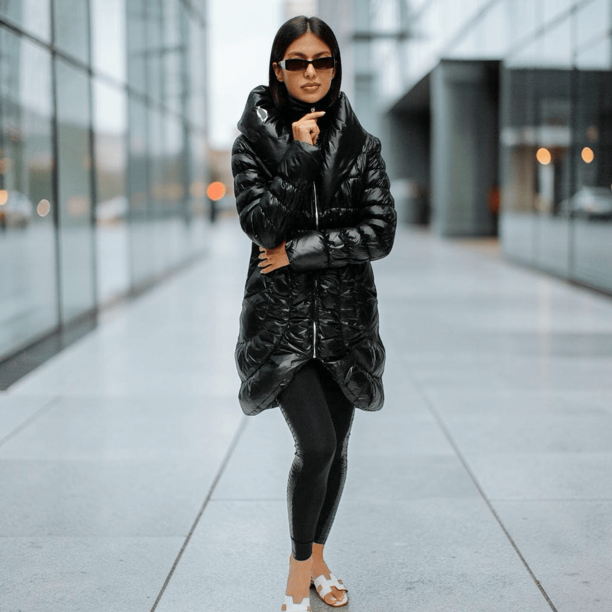 Plum Bottom CIAO MILANO black long puffer coat with shawl collar and ruffled back detail worn by a model
