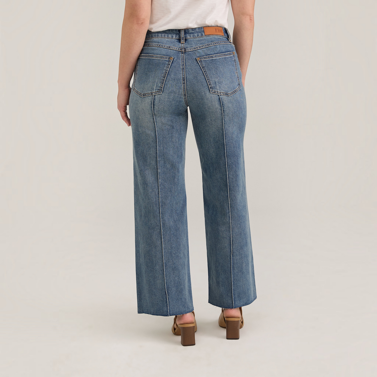 Plum Bottom FDJ Olivia wide ankle jeans in medium wash denim with a back seam detail and raw hem