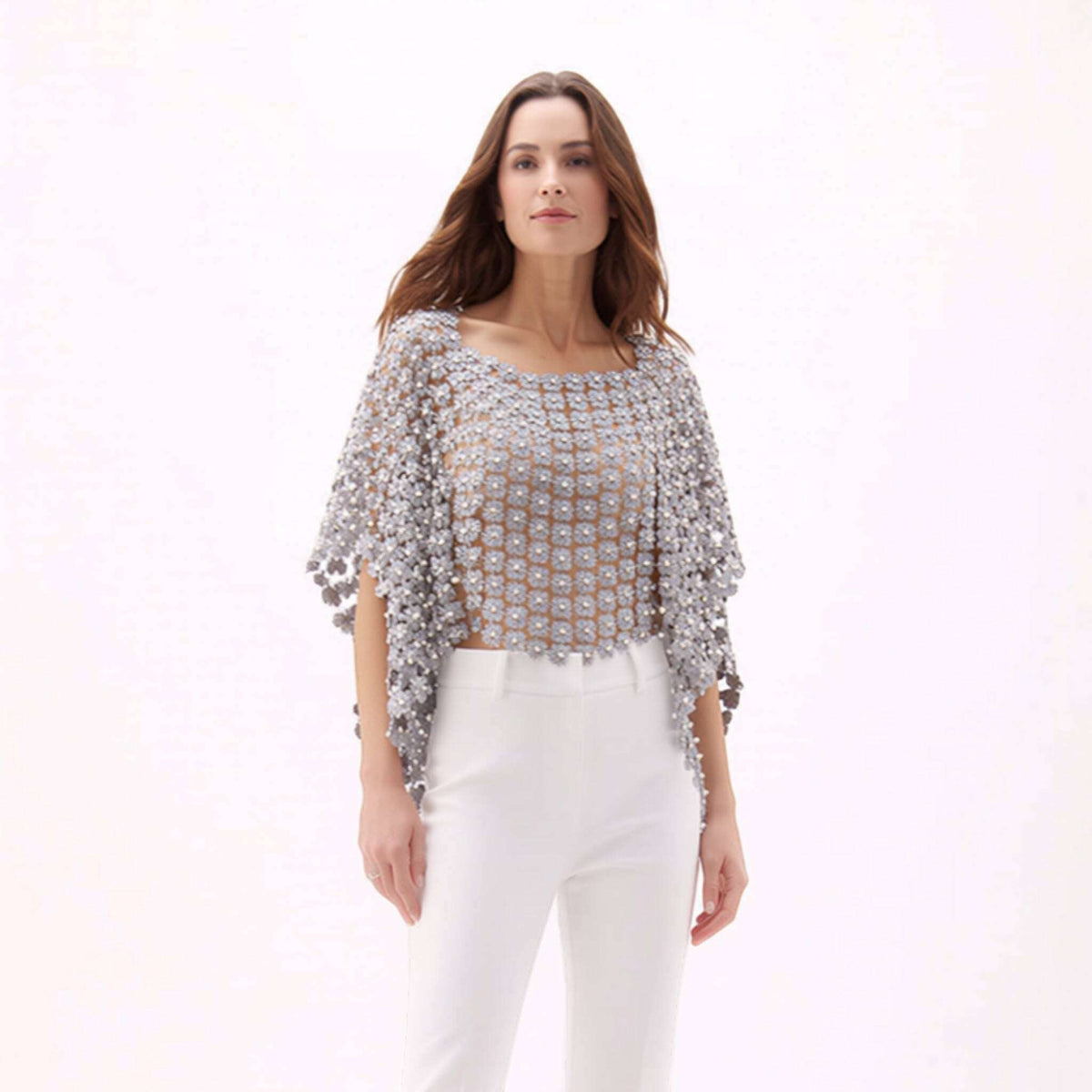 Plum Bottom ELLYNDALE grey lace poncho with white pearl embellishments worn by a model with white trousers