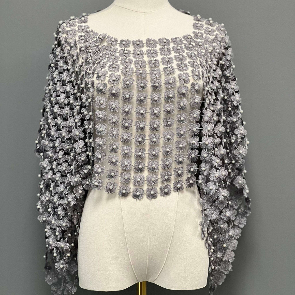 Plum Bottom ELLYNDALE short grey lace poncho featuring delicate white pearl embellishments on a mannequin