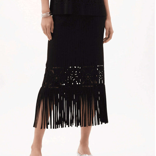 Plum Bottom ELLYNDALE black pleated midi skirt with intricate cutout details and a long fringe hem on a model