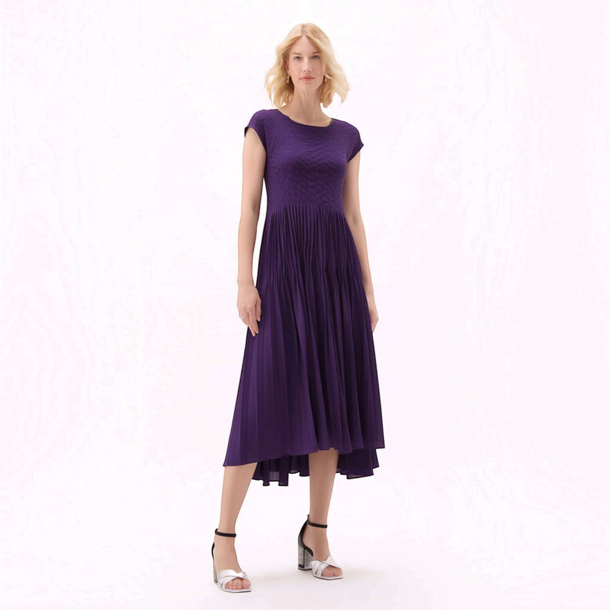 Plum Bottom ELLYNDALE violet pleated midi dress with cupsleeves worn by a blonde model on a white background