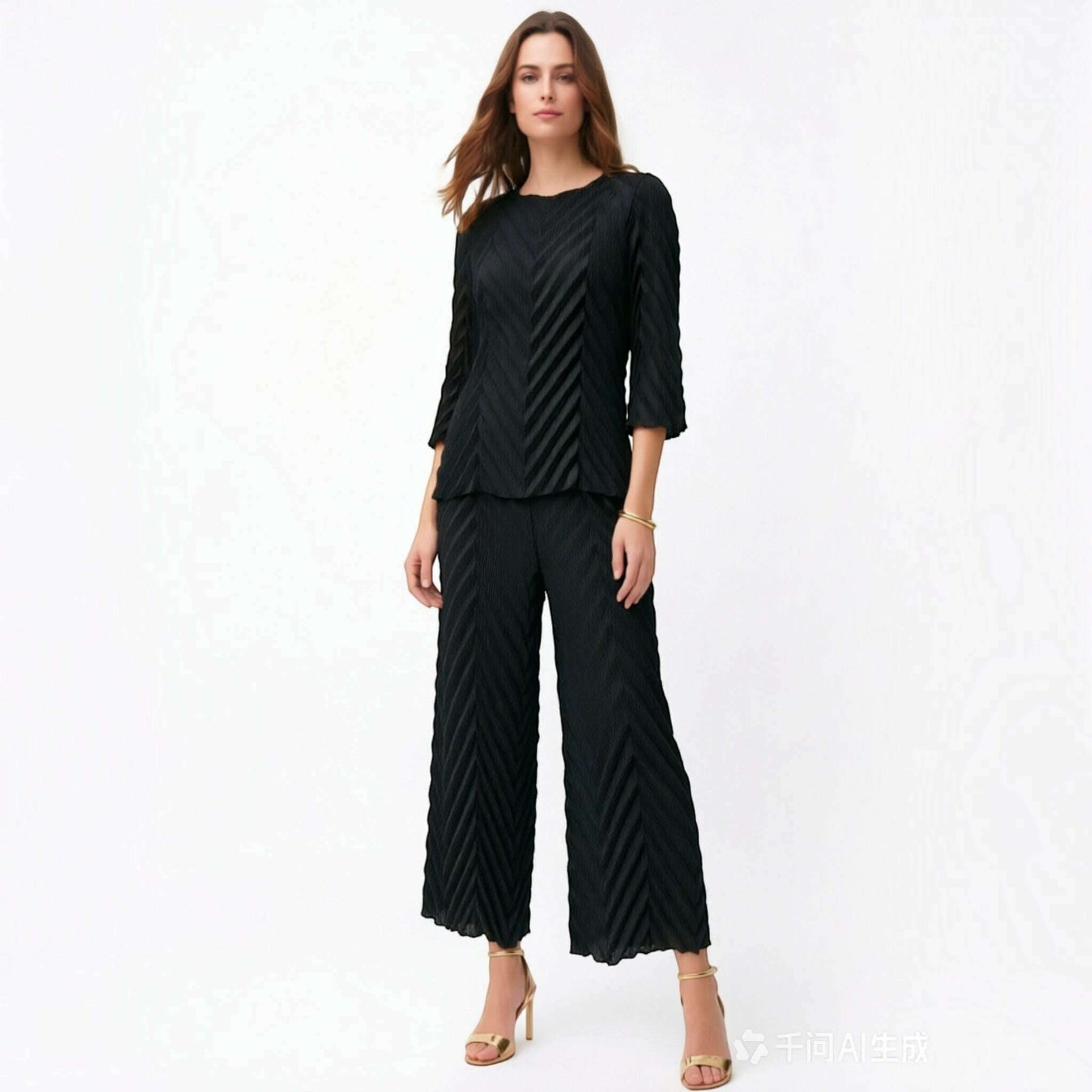Plum Bottom Ellyndale black pleated chevron flow top with bell sleeves and matching wide-leg trousers on a model.