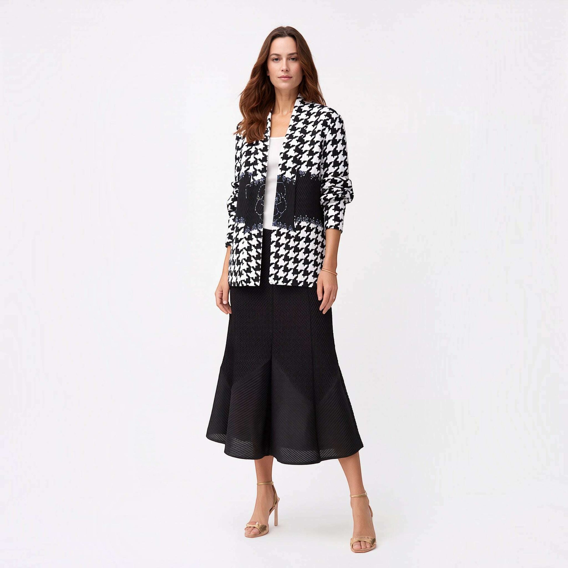 Plum Bottom Ellyndale pleated jacket with a shawl collar in a black and white houndstooth pattern on a model.