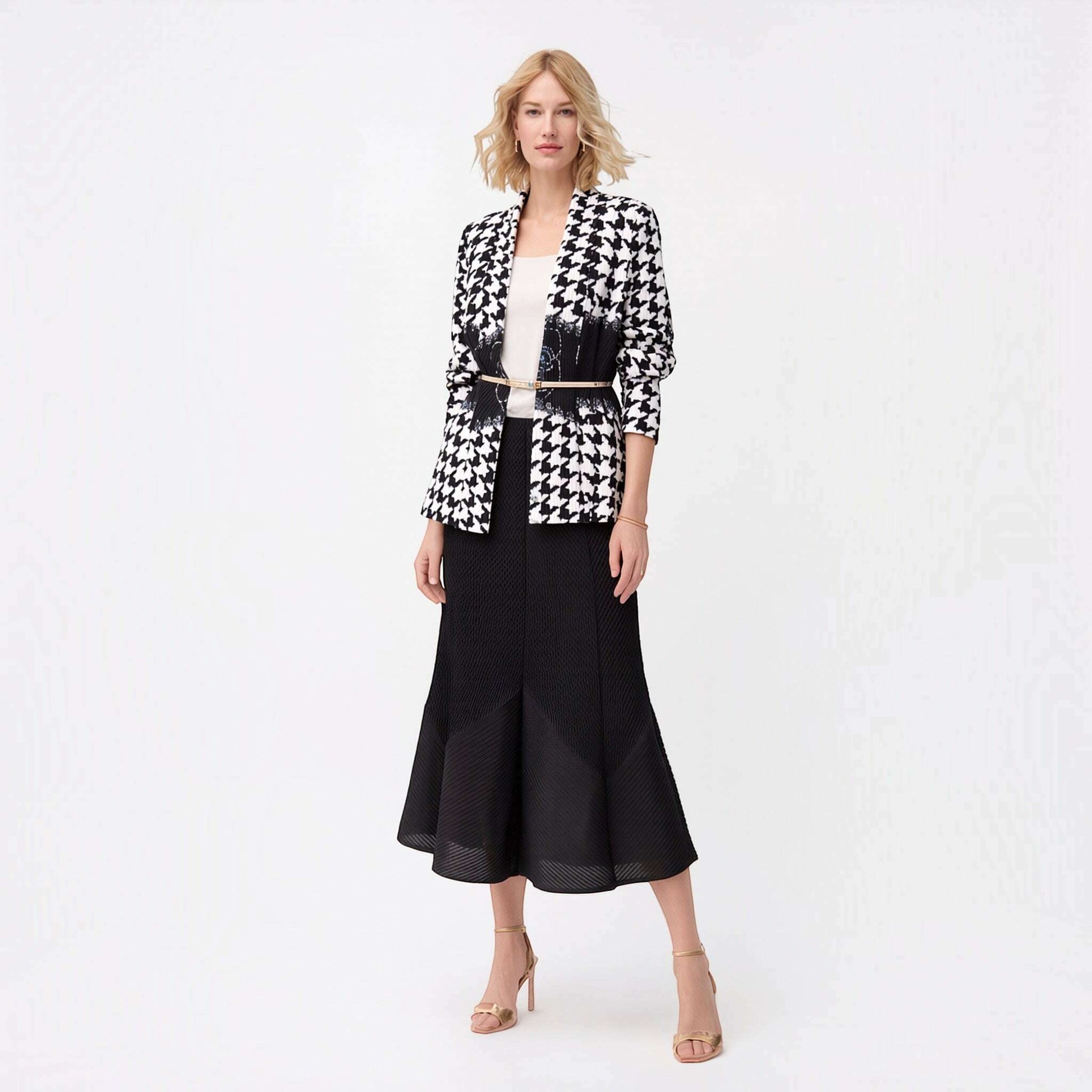 Plum Bottom Ellyndale pleated houndstooth jacket with shawl collar worn by a model over a white top and black skirt.
