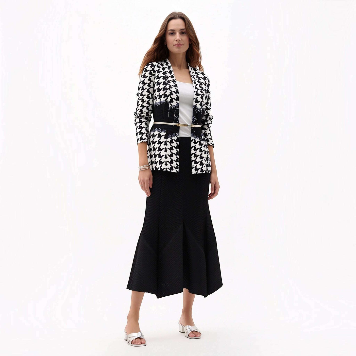 Plum Bottom Ellyndale pleated houndstooth jacket with a shawl collar worn over a white top and black midi skirt