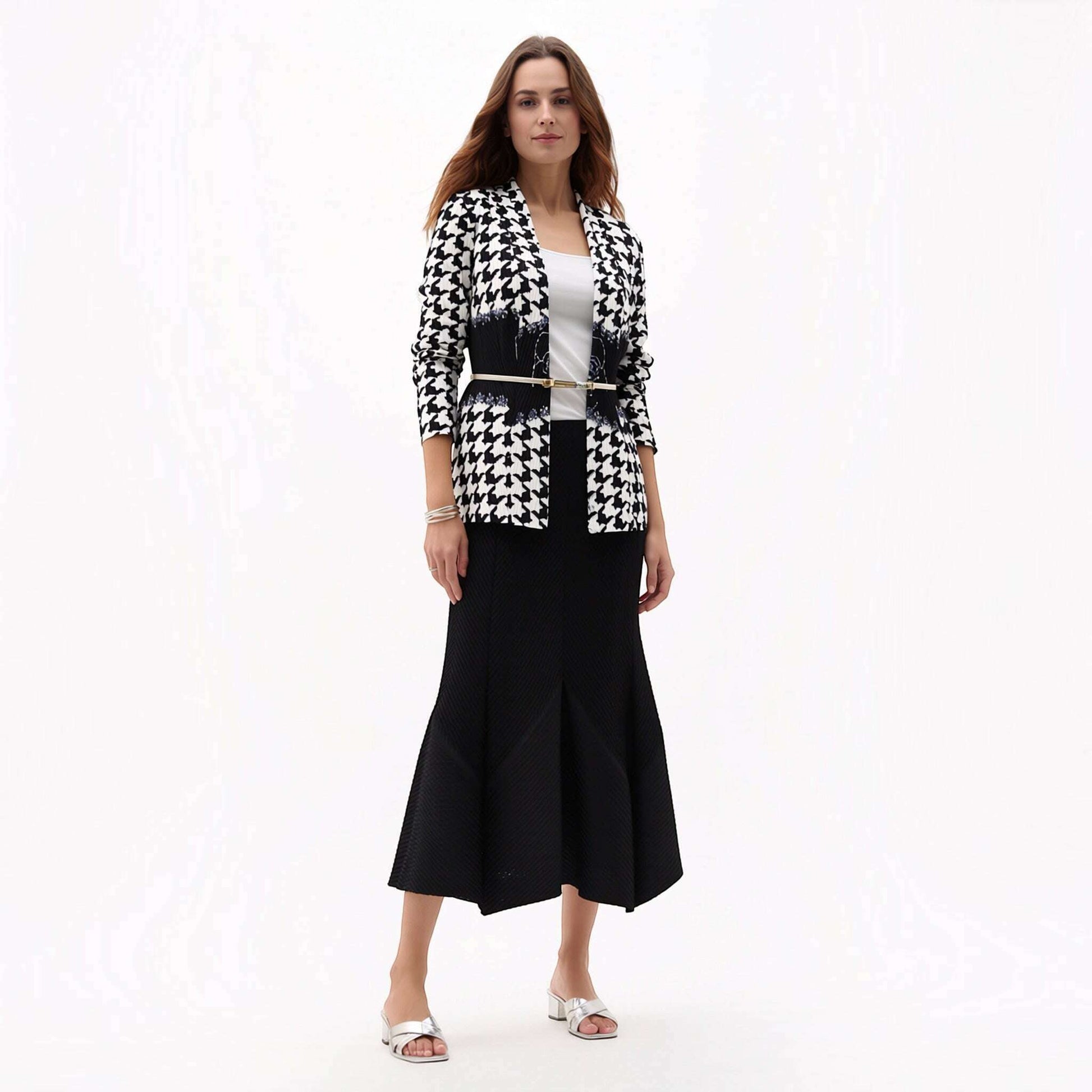 Plum Bottom Ellyndale pleated houndstooth jacket with a shawl collar worn over a white top and black midi skirt