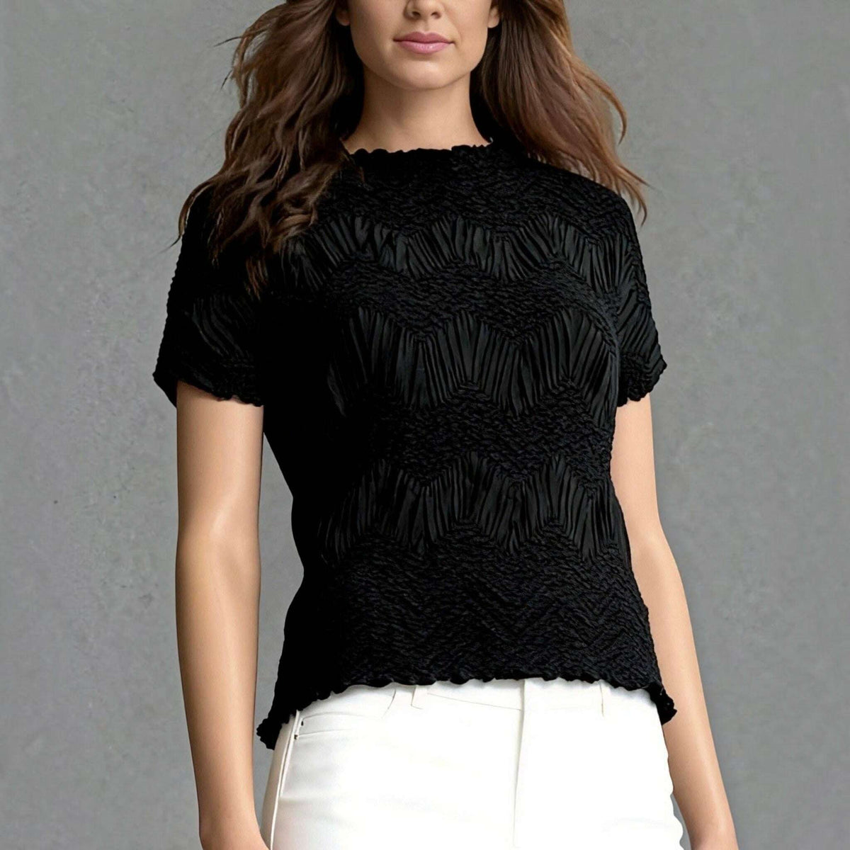 Plum Bottom Ellyndale black short-sleeve top with a sculptural crochet wave pleated texture and crew neckline.