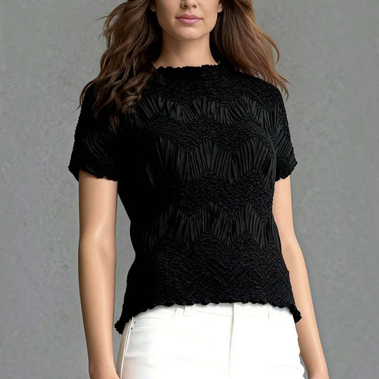 Plum Bottom Ellyndale black short-sleeve top with a sculptural crochet wave pleated texture and crew neckline.