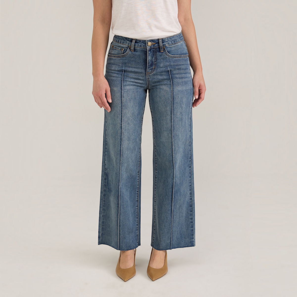 Plum Bottom FDJ Olivia wide ankle jeans in medium wash denim with front seam detailing worn with tan heels