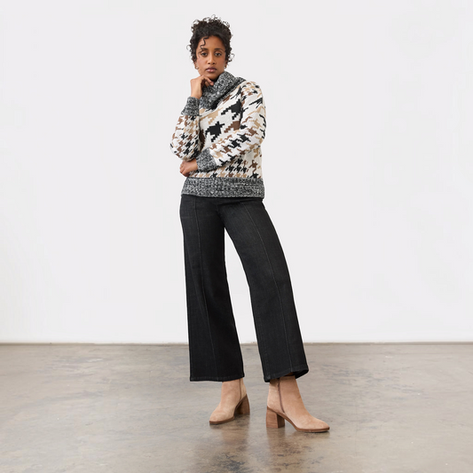 Plum Bottom FDJ Olivia black wide leg jeans with pintuck detail worn by a model with a patterned turtleneck sweater