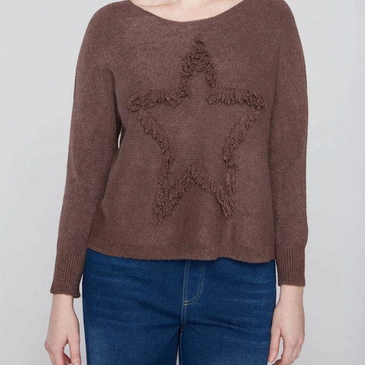 Plum Bottom COMPLI K brown knit sweater featuring a textured fringe star design on the front worn by a model
