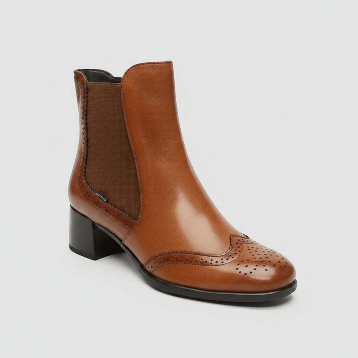 Plum Bottom FLUCHOS Ikia D9368 tan leather Chelsea boot with brogue detailing and a comfortable mid-block heel.