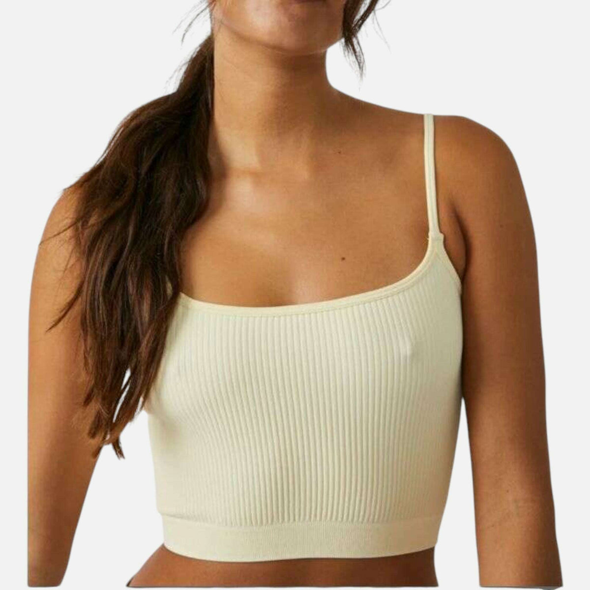 Plum Bottom Free People recycled ribbed brami in a cream shade with pale yellow undertones and thin spaghetti straps.