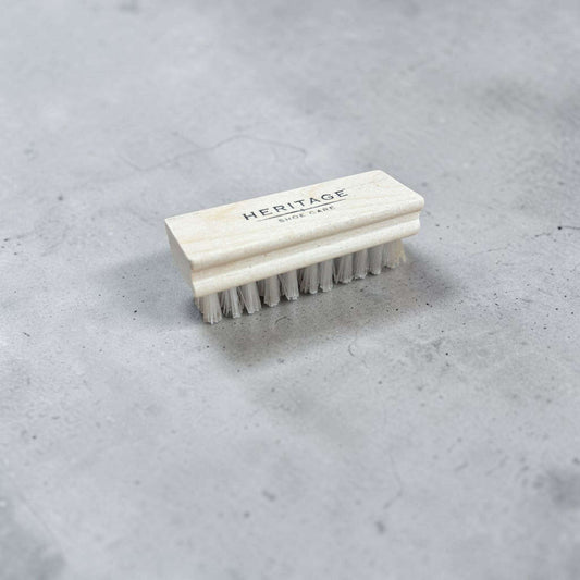Plum Bottom Heritage Shoe Care suede brush with a light wood handle and soft white bristles