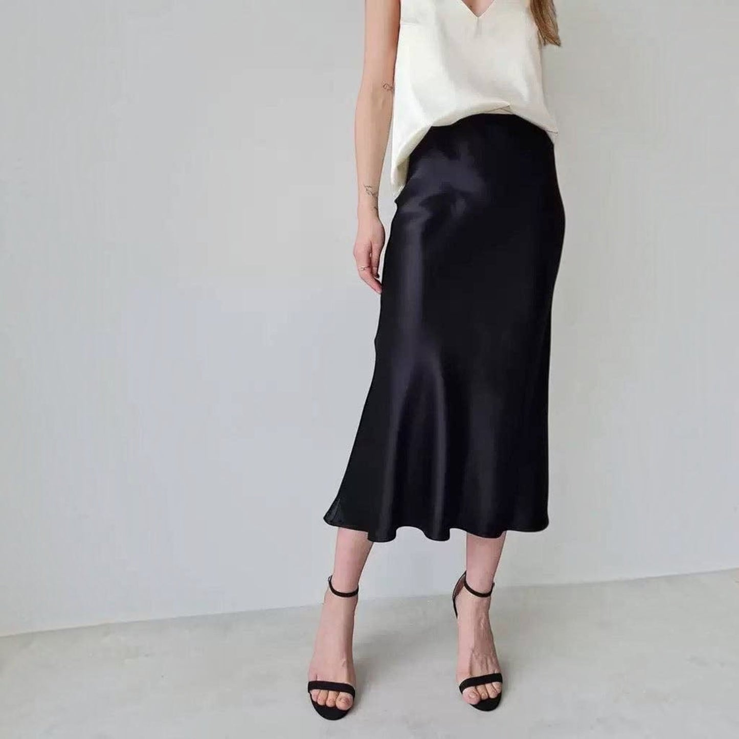 Plum Bottom ELLYNDALE black sateen maxi skirt with elastic waistband and invisible zipper on a model