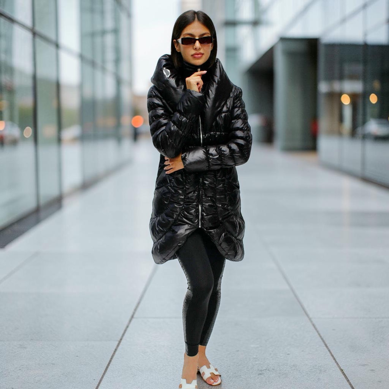 Plum Bottom CIAO MILANO black long puffer coat with shawl collar and ruffled back detail worn by a model