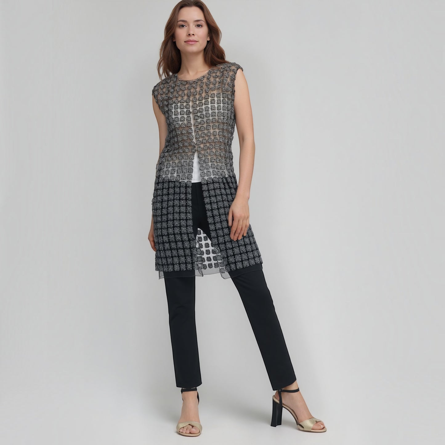 Plum Bottom ELLYNDALE black sleeveless organza vest with lace pattern and pearl buttons worn by a model
