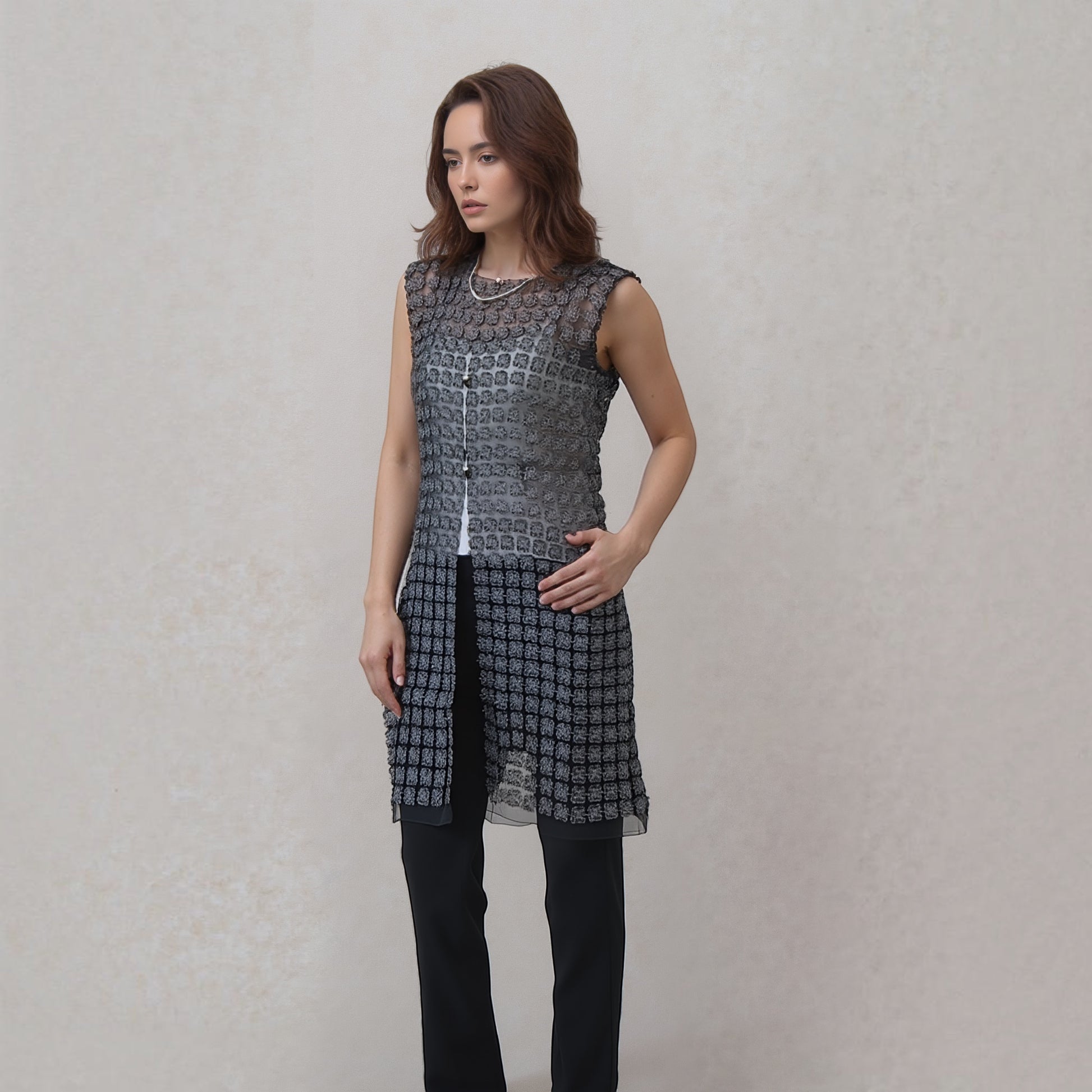 Plum Bottom ELLYNDALE black lace organza sleeveless long vest with pearl buttons worn by a model