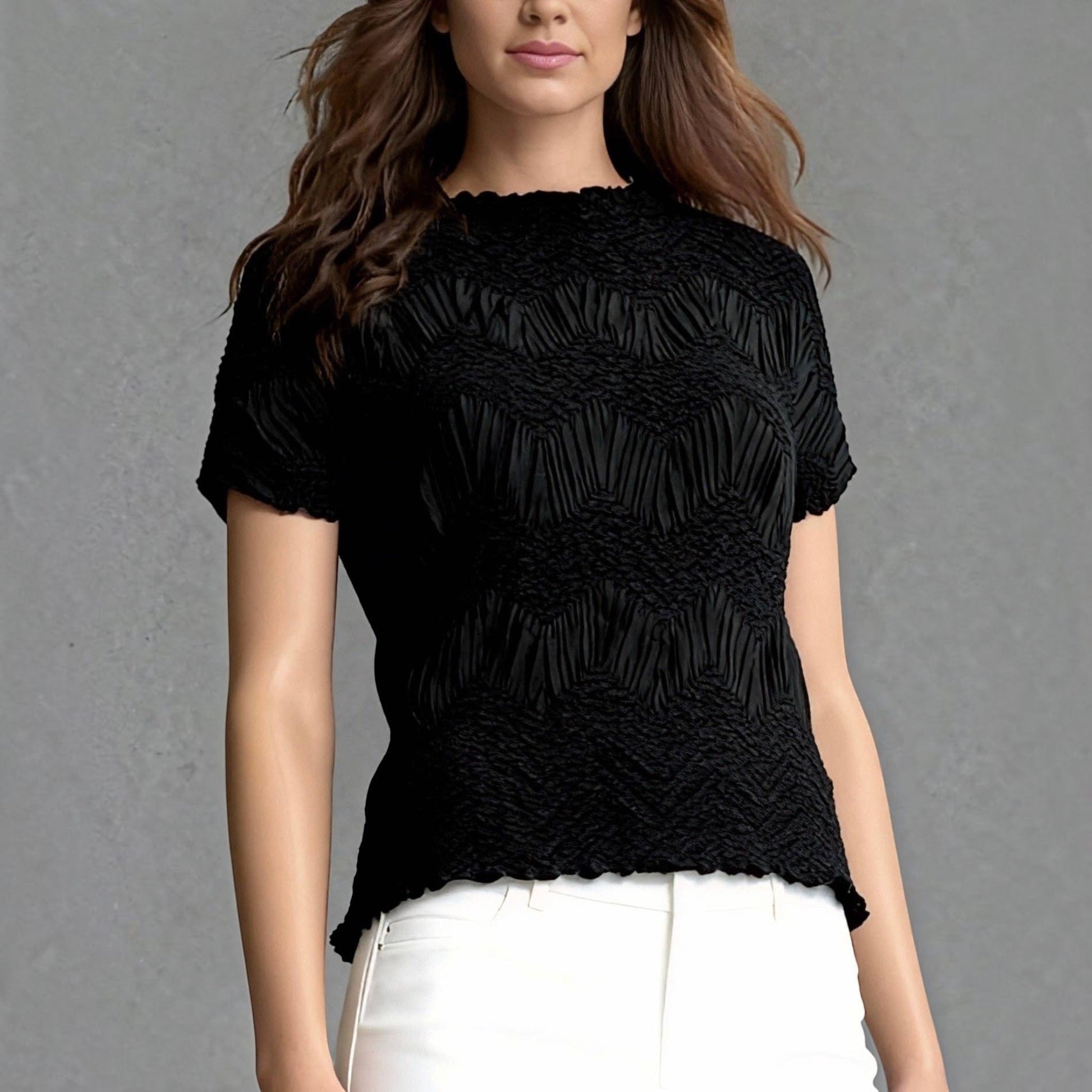 Plum Bottom Ellyndale black short-sleeve top with a sculptural crochet wave pleated texture and crew neckline.