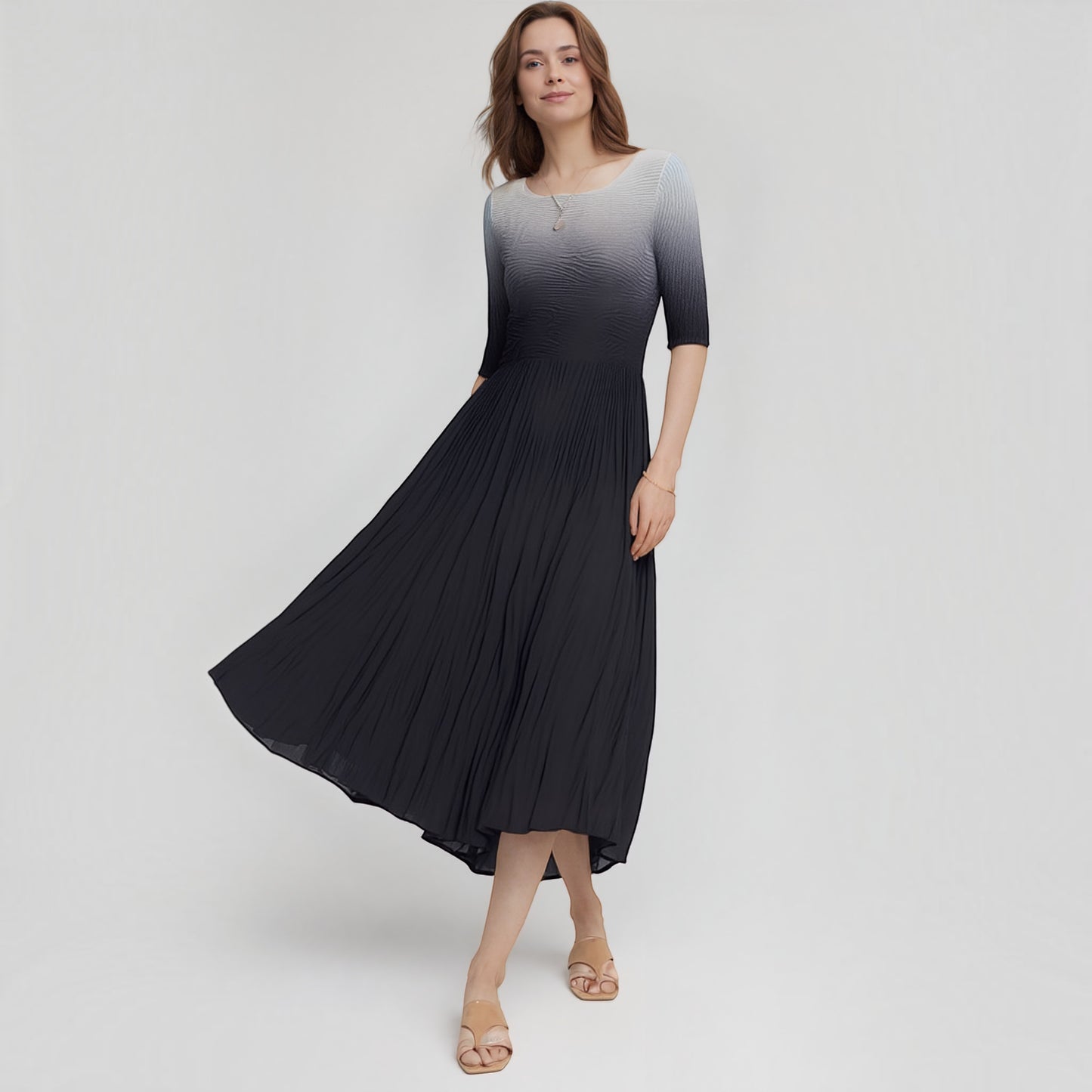 Plum Bottom ELLYNDALE pleated ombre dress with 3/4 sleeves in black and grey worn by a model on a white background.
