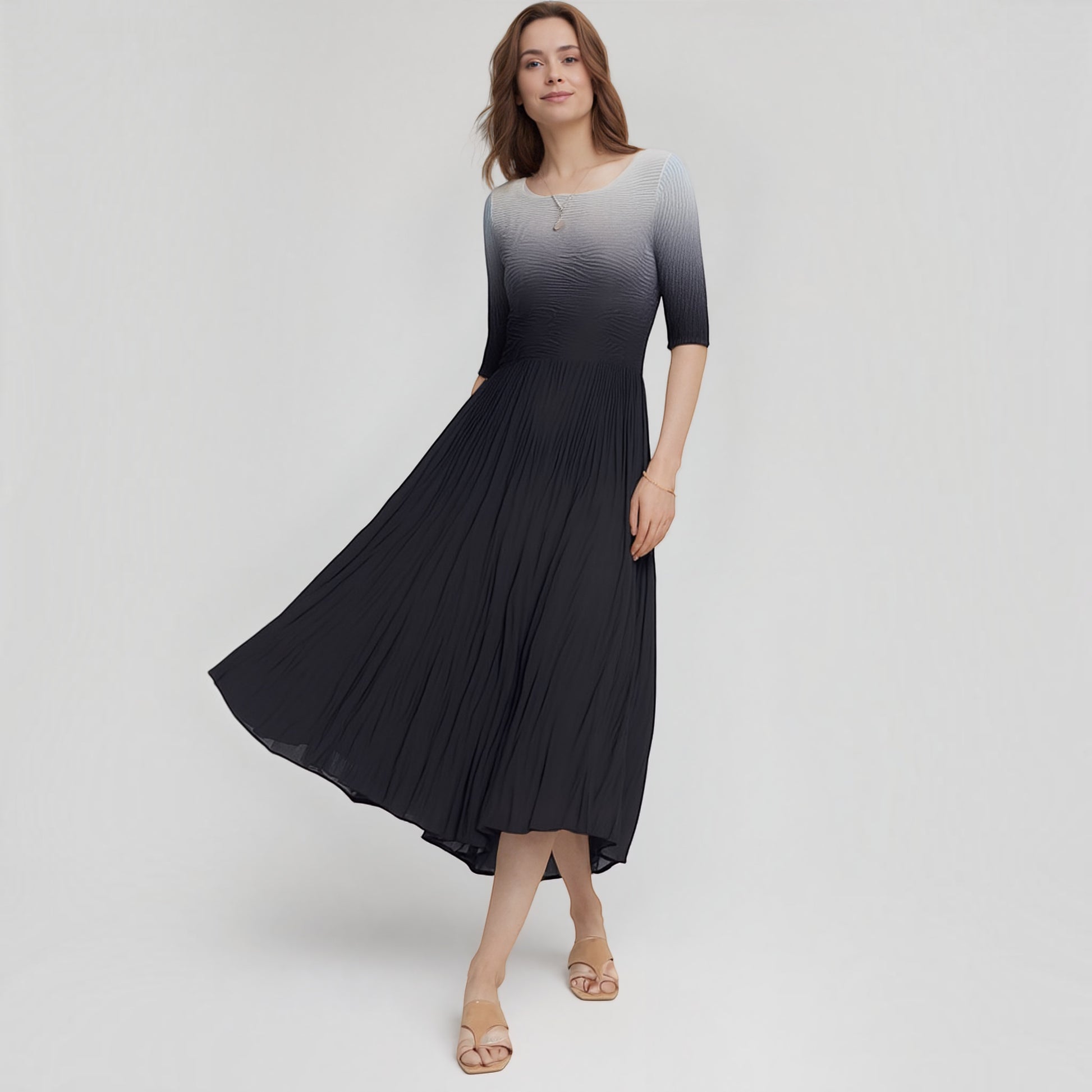 Plum Bottom ELLYNDALE pleated ombre dress with 3/4 sleeves in black and grey worn by a model on a white background.