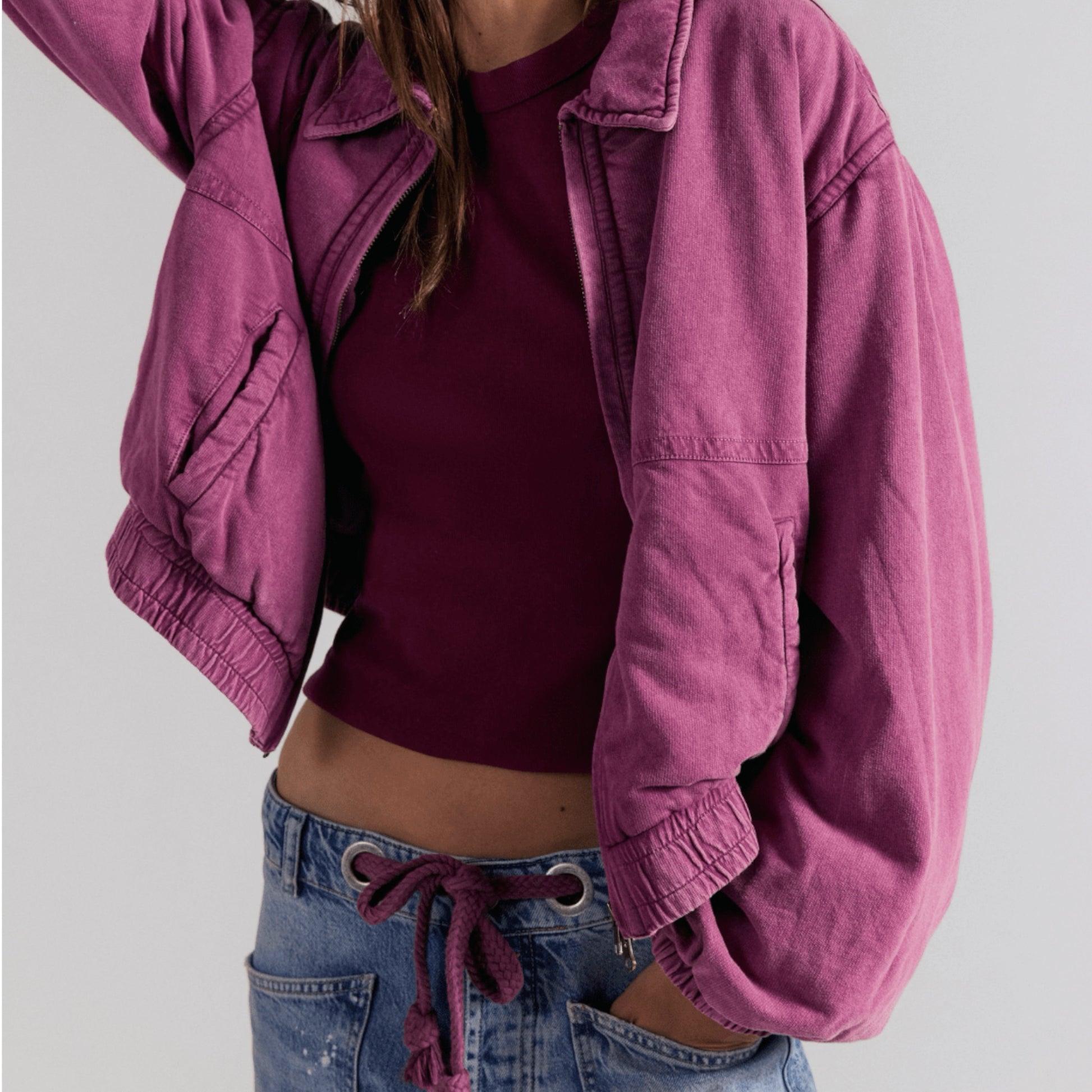 Plum Bottom Free People Birdie washed purple cotton bomber jacket with a collared neckline and relaxed fit
