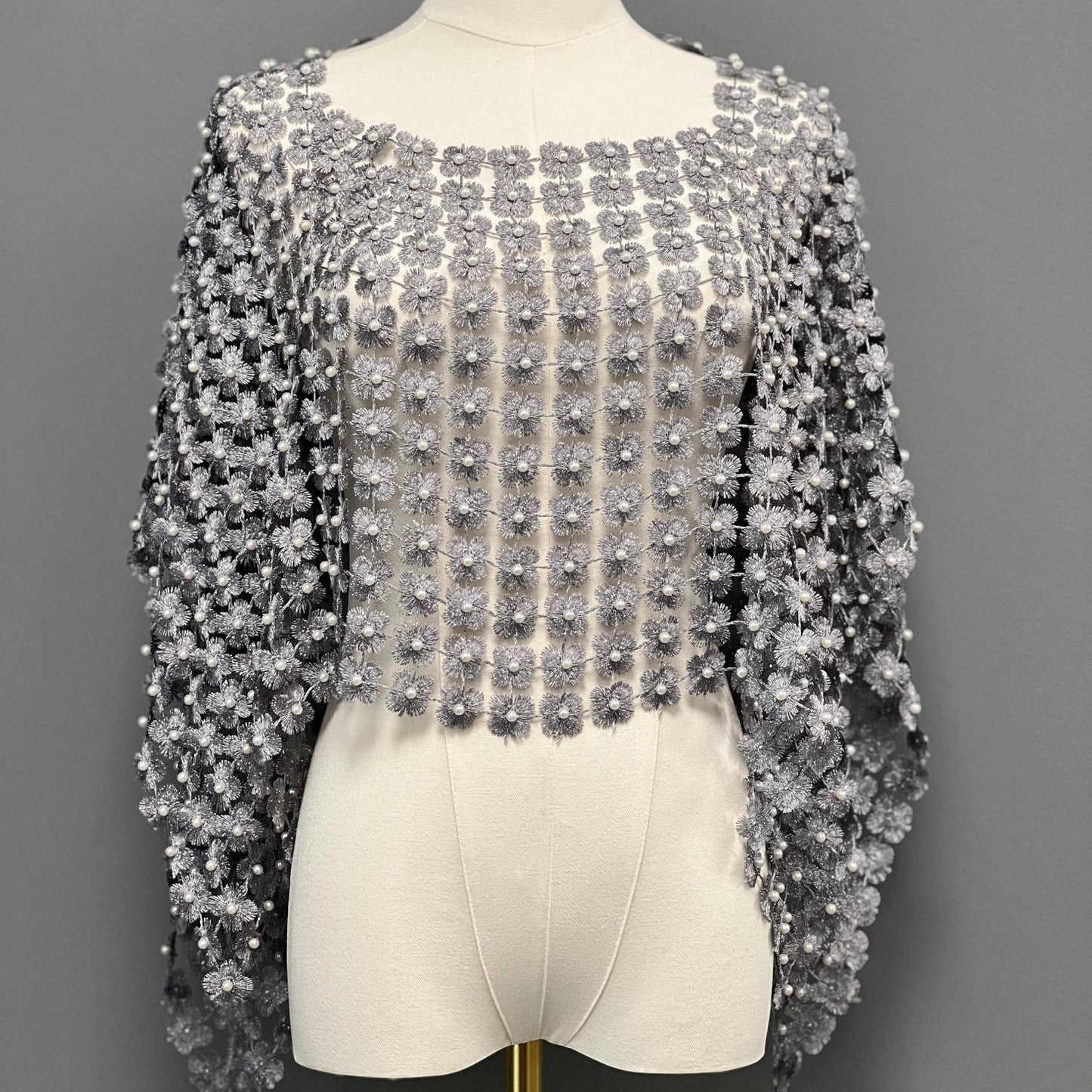 Plum Bottom ELLYNDALE short grey lace poncho featuring delicate white pearl embellishments on a mannequin