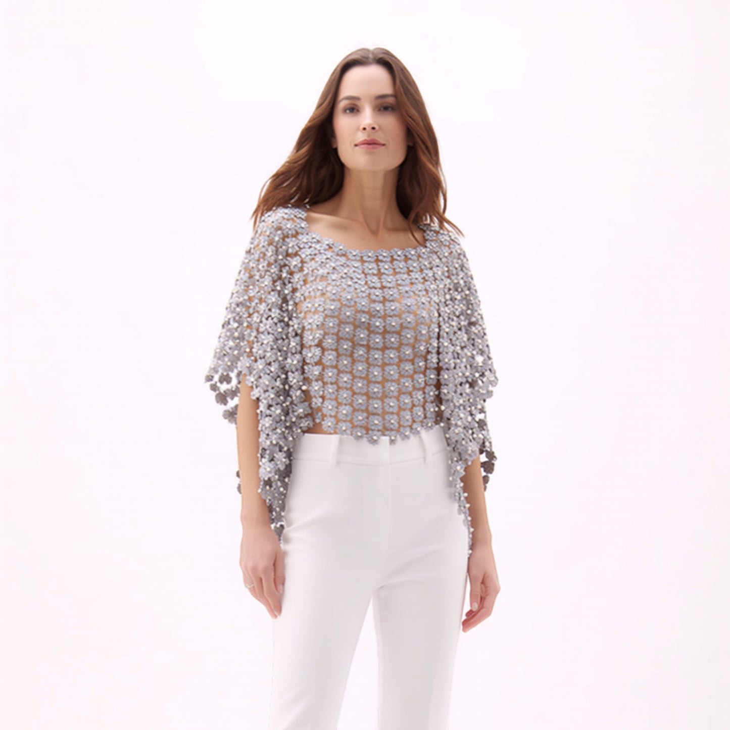 Plum Bottom ELLYNDALE grey lace poncho with white pearl embellishments worn by a model with white trousers