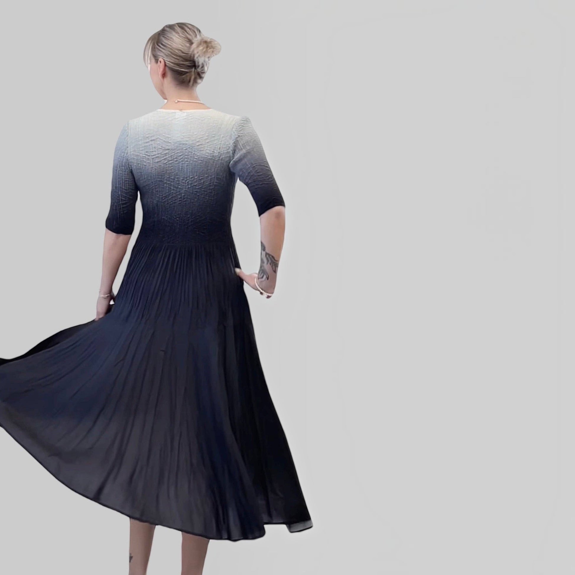 Plum Bottom ELLYNDALE pleated ombre dress with 3/4 sleeves in black and grey, shown from the back.