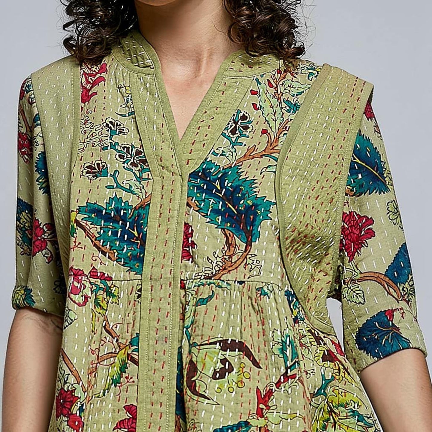 Plum Bottom Pol Clothing quilted floral kimono-style top in powder olive with contrast hand-stitch detailing.