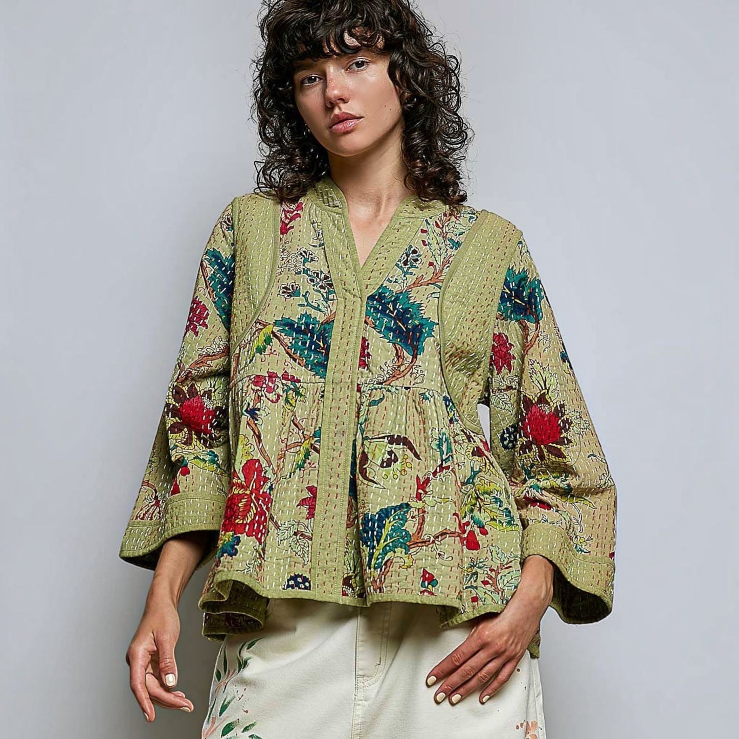 Plum Bottom Pol Clothing quilted floral kimono-style top in powder olive with contrast hand-stitch detailing.
