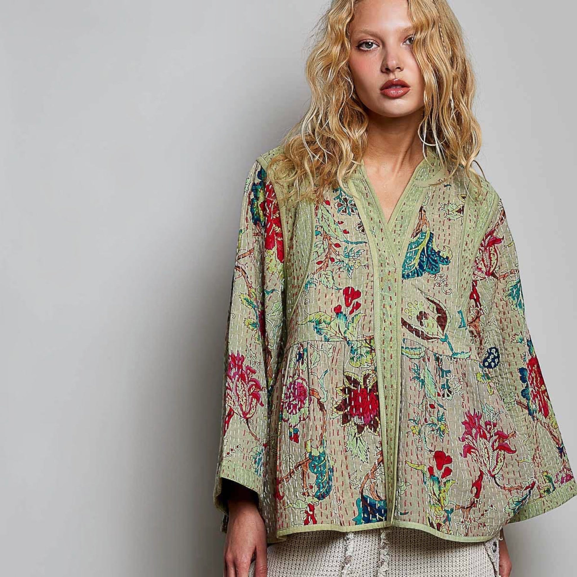 Plum Bottom Pol Clothing quilted floral kimono-style top in powder olive with contrast hand-stitch detailing.