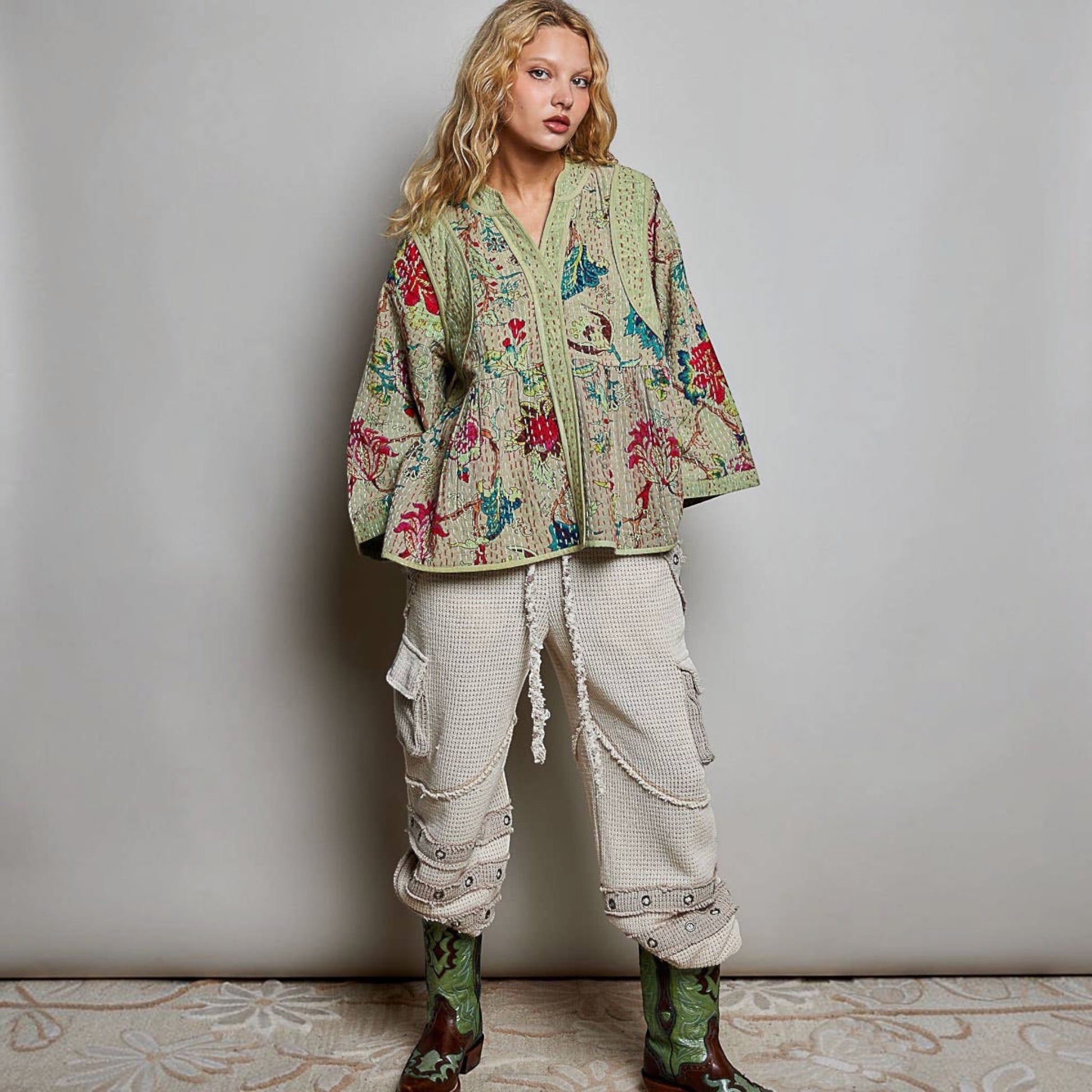 Plum Bottom Pol Clothing quilted floral kimono-style top in powder olive with hand-stitch detail and wide sleeves.