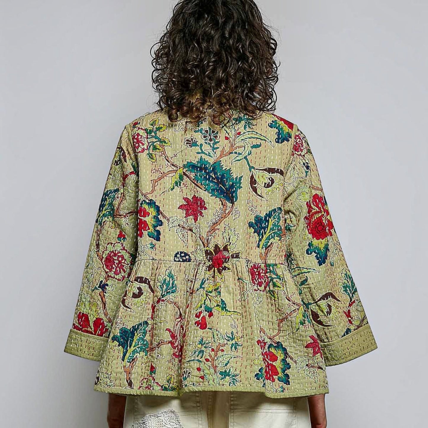 Plum Bottom quilted floral kimono-style top in powder olive with contrast hand-stitch detailing and wide sleeves.