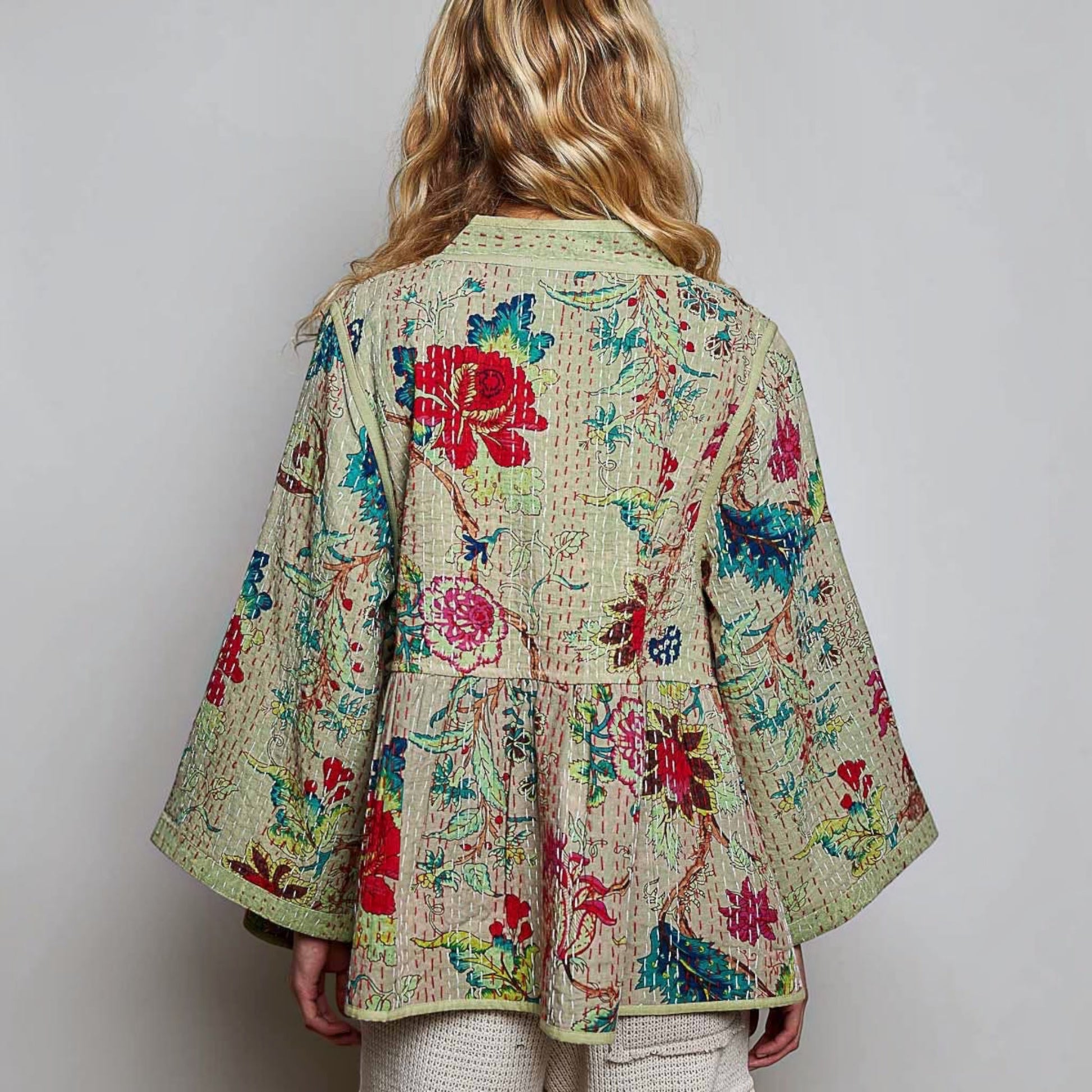 Plum Bottom Pol Clothing quilted floral kimono top in powder olive with contrast hand-stitch detail and wide sleeves.