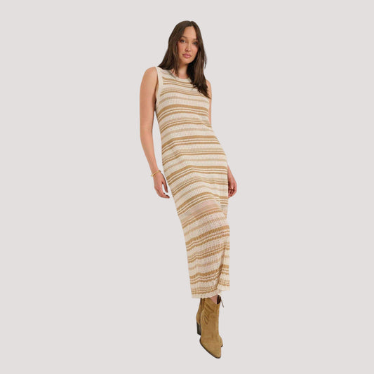 Plum Bottom Seventy Eight and Sunny Ruby crochet midi dress with sheer pointelle stripes and tan suede boots.