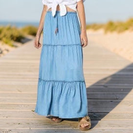 Plum Bottom tiered denim skirt in light blue lyocell with a wooden tie waist detail