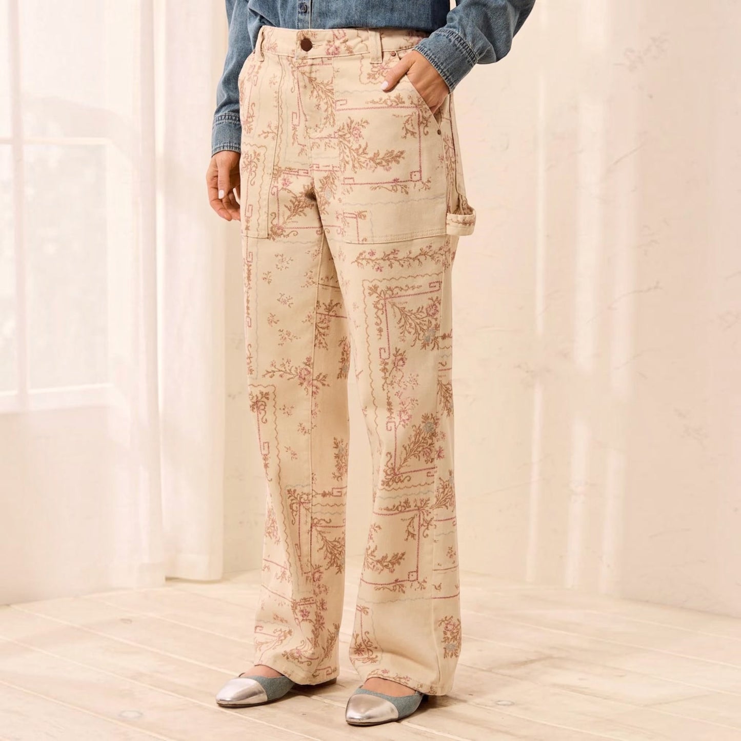 Plum Bottom TRIBAL Audrey carpenter pants in cream with a vintage-style floral print and utility pocket details.