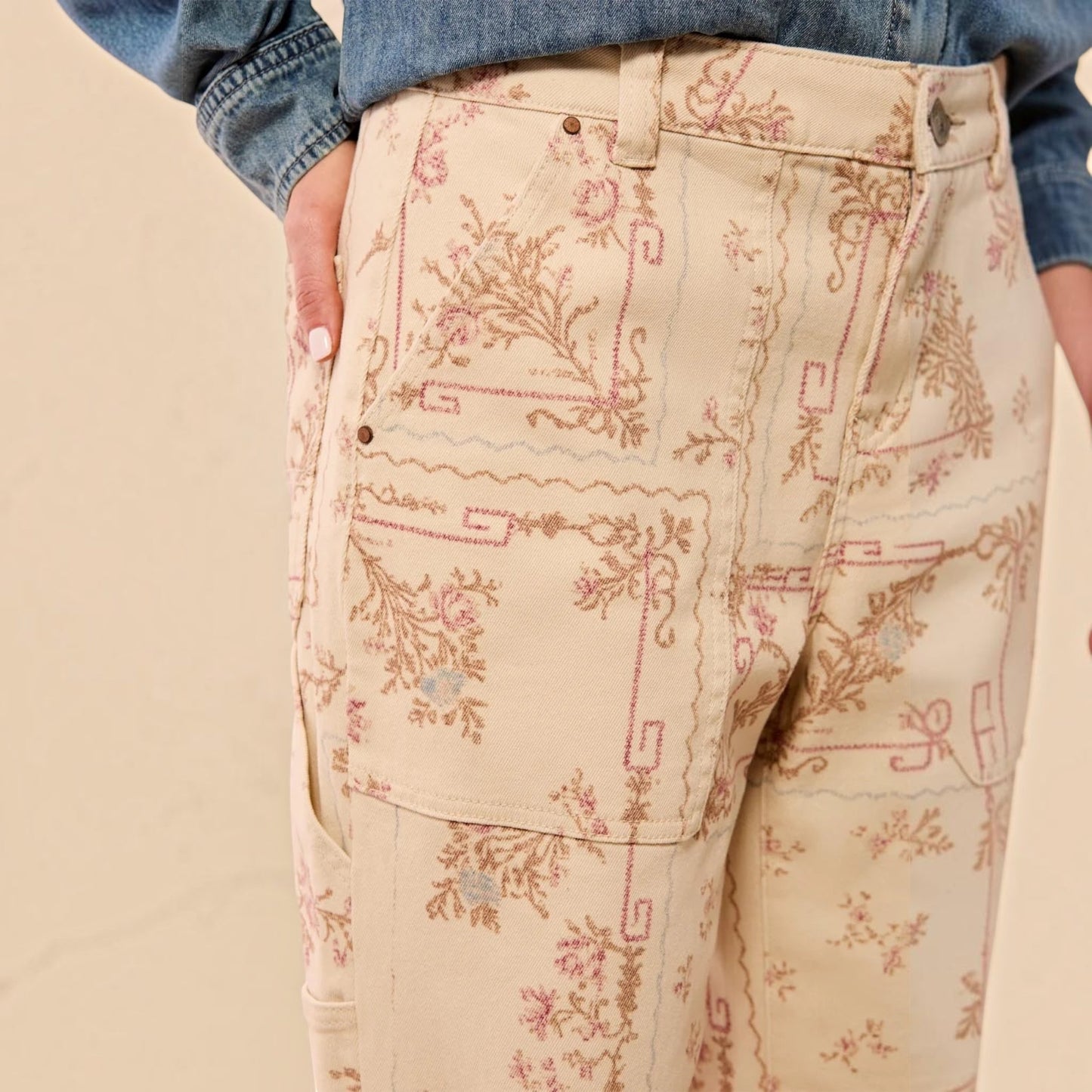Plum Bottom TRIBAL Audrey carpenter pants in cream with a vintage-inspired pink and brown floral print pattern